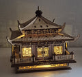 Laserskåret asiatisk tempel i træ med varm LED-belysning indeni